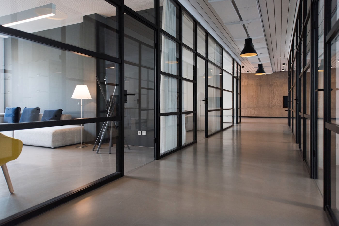 Modern glass office workspace with frosted partitions